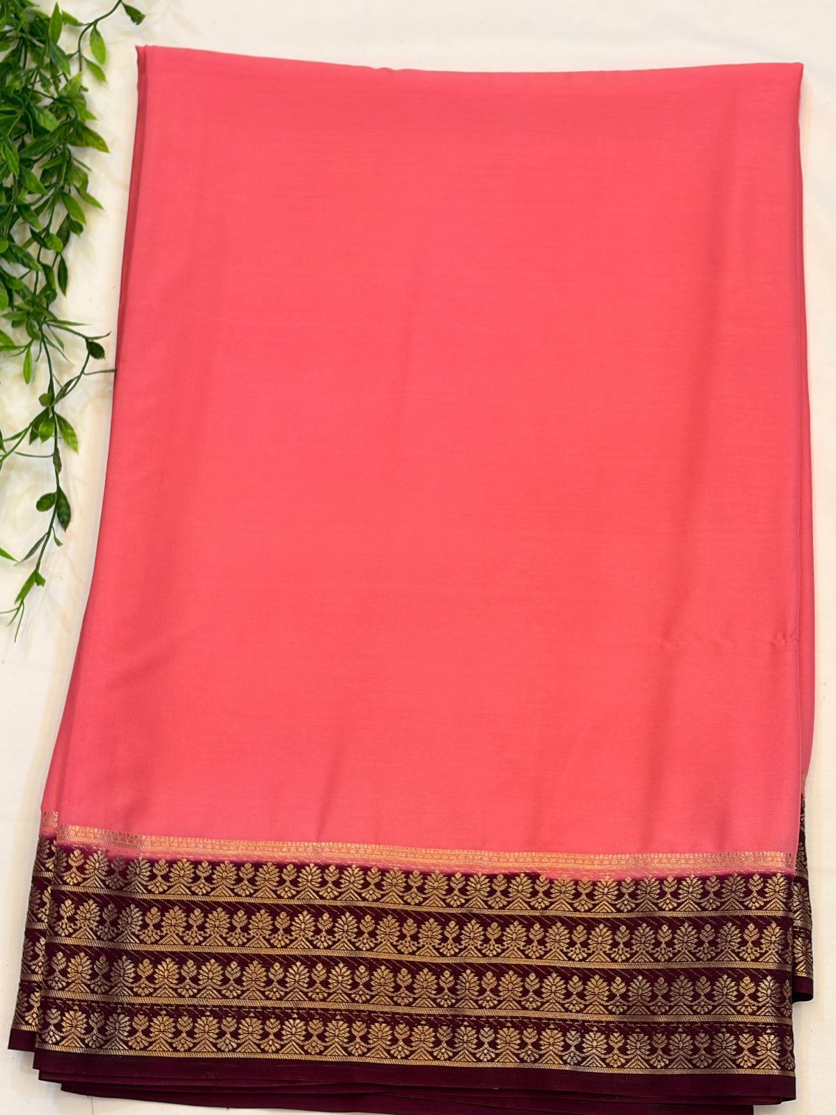 Peach Crepe Silk saree with Maroon Zari Border
