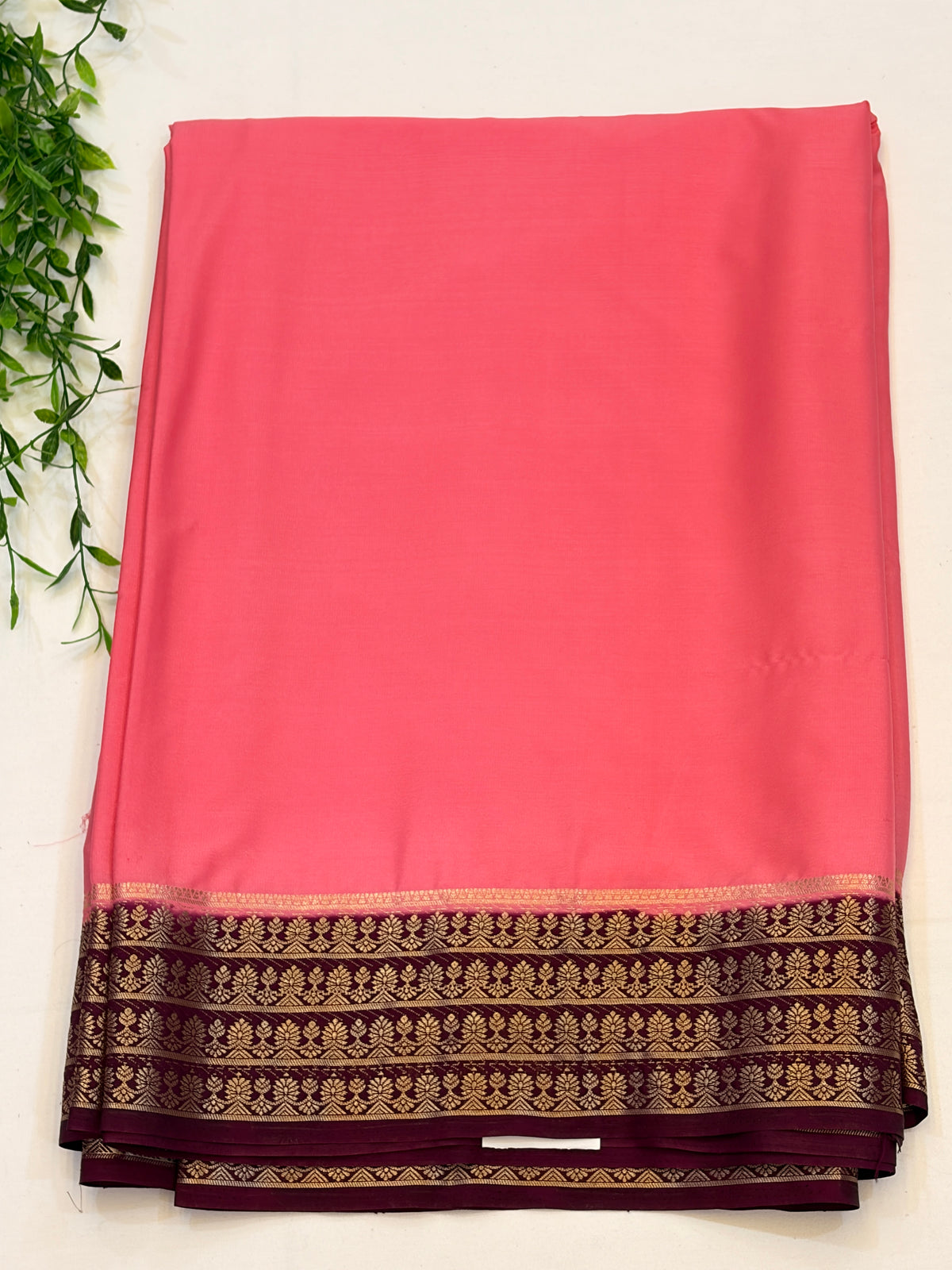 Peach Crepe Silk saree with Maroon Zari Border