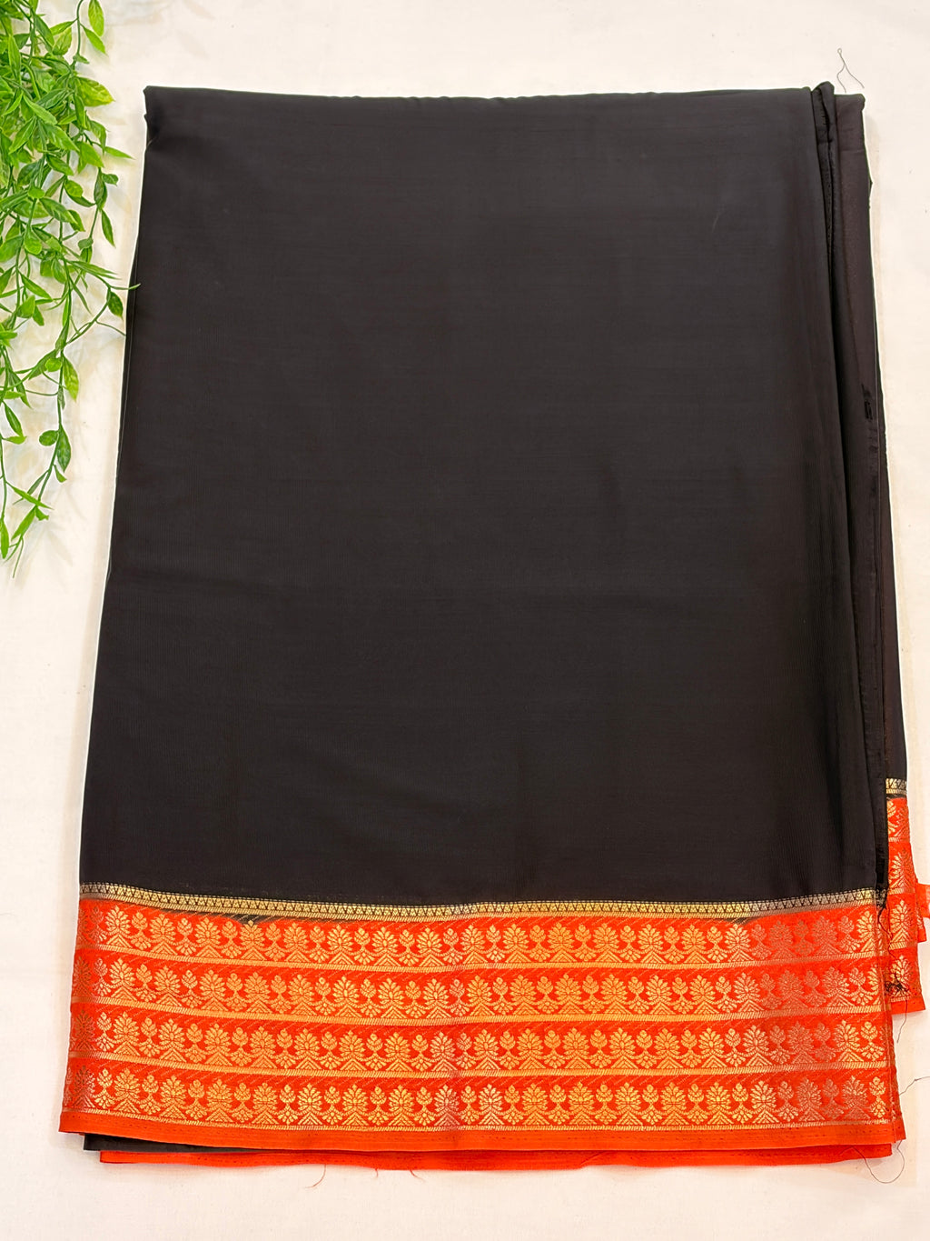 Black Crepe Silk saree with Orange Zari Border