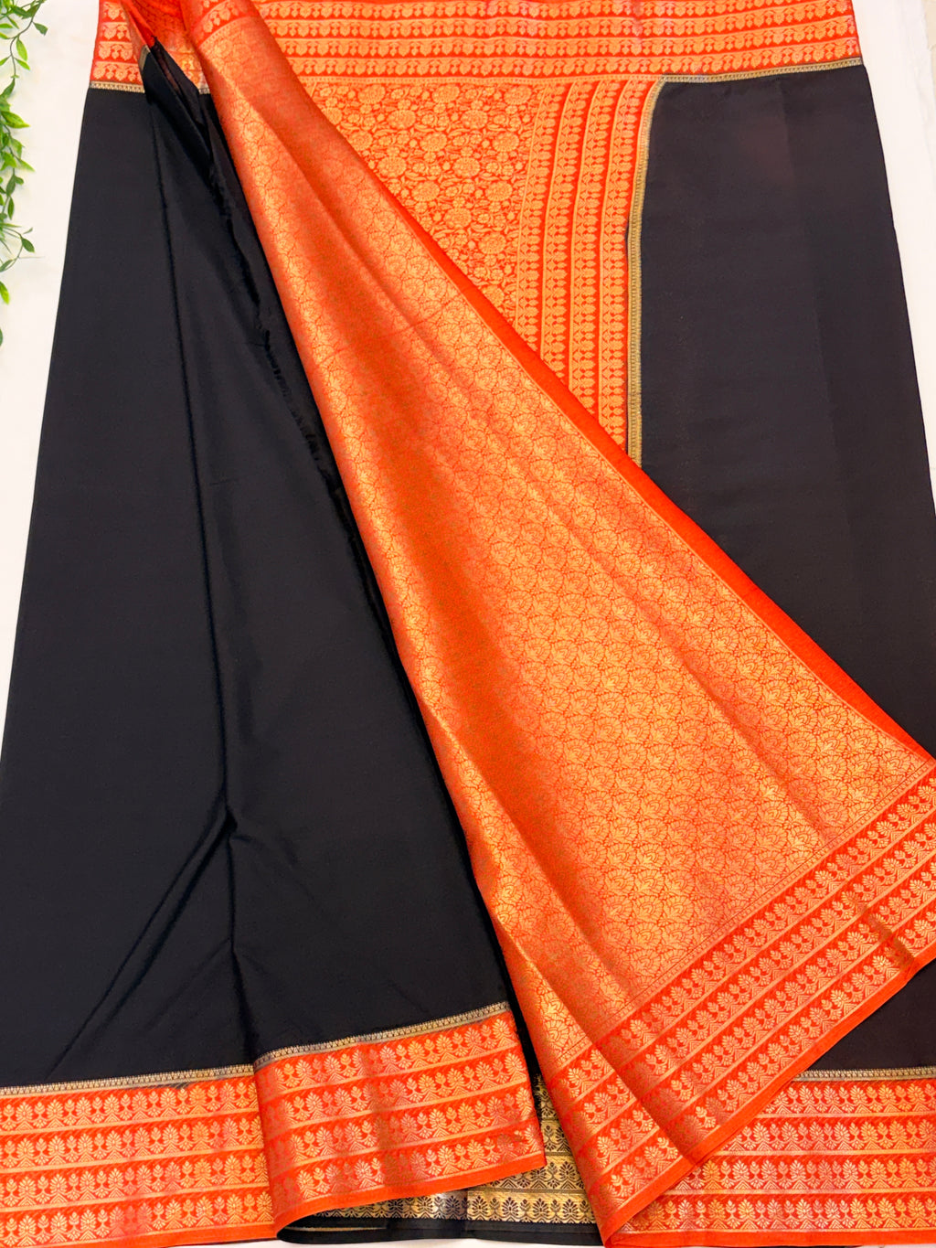 Black Crepe Silk saree with Orange Zari Border