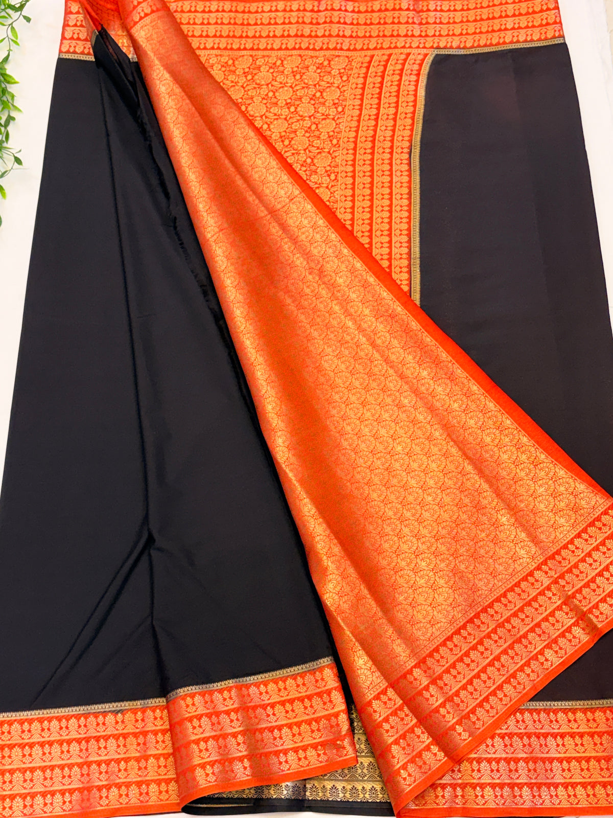 Black Crepe Silk saree with Orange Zari Border