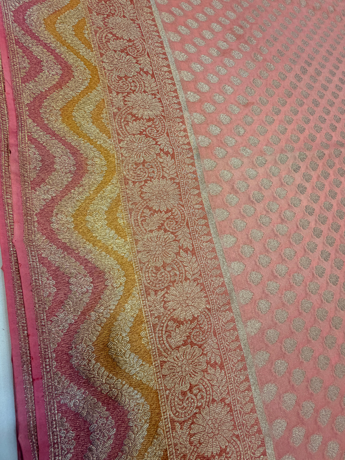 Peach Pink Khaddi Georgette Saree with Silver Buttis